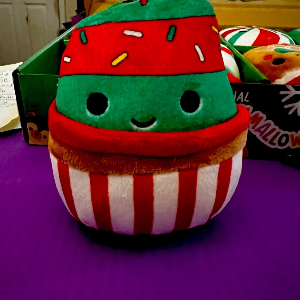 Squishmallow Chantal is a cupcake ornament with green & red frosting.